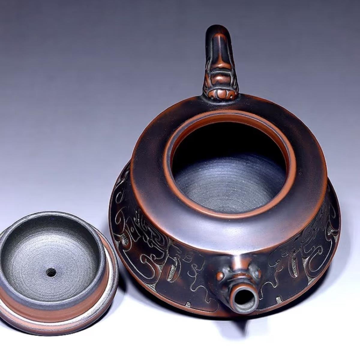Hand-carved Nixing clay teapot - product detail view 6