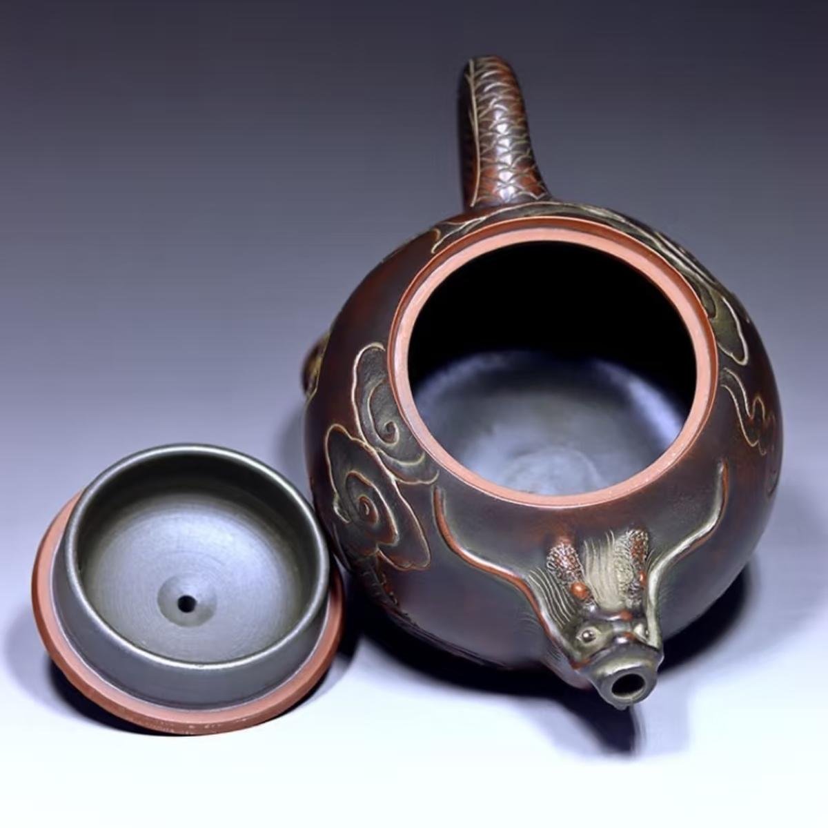 Hand-carved Nixing clay teapot - product detail view 6