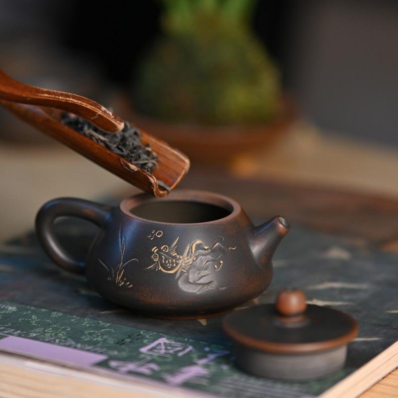 Hand-carved Nixing clay teapot - product detail view 2